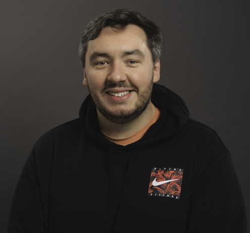 Andrew Chapman, digital marketing strategist at Weavers & Co, wearing a black Nike hoodie — Burnley-based SEO and content marketing expert.